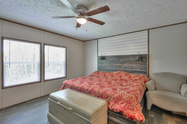 5077 Southpoint Ridge Rd, Hampshire, TN 38461 - bedroom featuring wood-type flooring, a textured ceiling, and ceiling fan