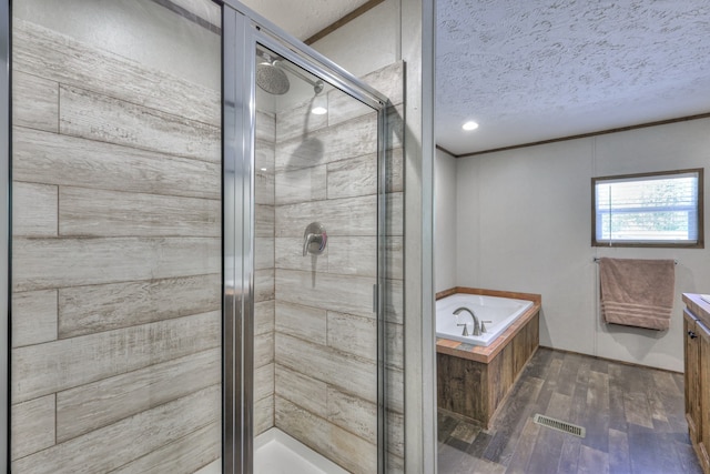 5077 Southpoint Ridge Rd, Hampshire, TN 38461 - bathroom featuring independent shower and bath, vanity, hardwood / wood-style flooring, and a textured ceiling