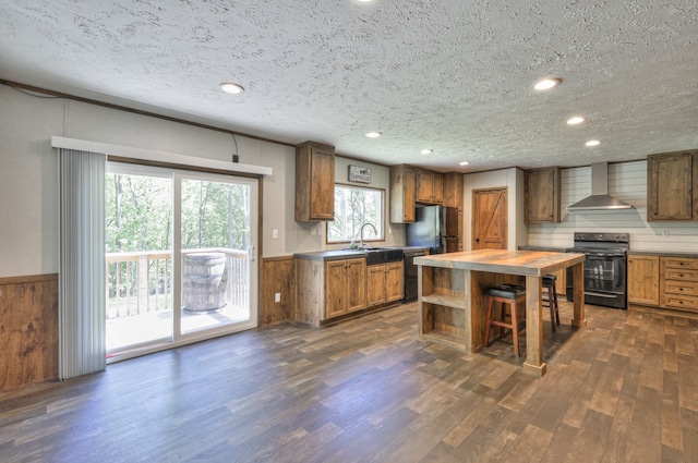 5077 Southpoint Ridge Rd, Hampshire, TN 38461 - kitchen with wall chimney exhaust hood, dark wood-type flooring, black appliances, sink, and a textured ceiling