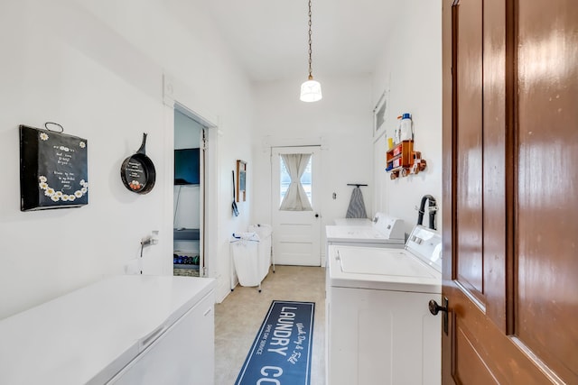 clothes washing area with independent washer and dryer