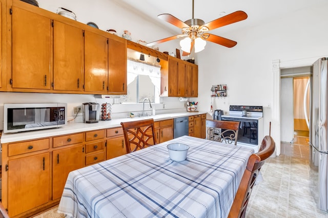 kitchen with ceiling fan, sink, and stainless steel appliances