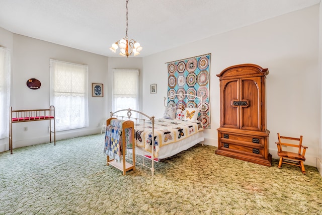 carpeted bedroom with an inviting chandelier