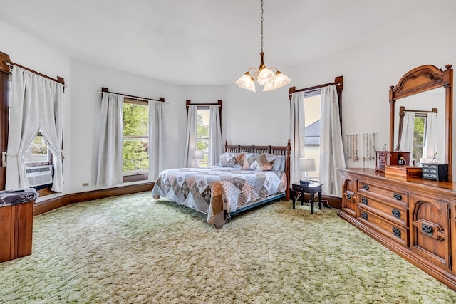 bedroom with carpet, a notable chandelier, cooling unit, and multiple windows