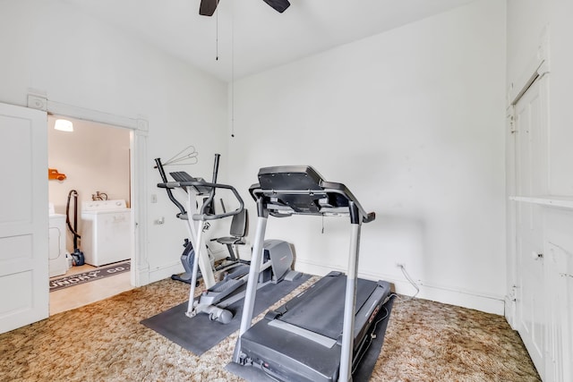 exercise area featuring washing machine and dryer, ceiling fan, and carpet floors