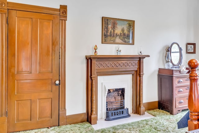 sitting room featuring carpet flooring