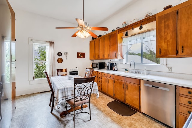 kitchen with ceiling fan, lofted ceiling, sink, and appliances with stainless steel finishes