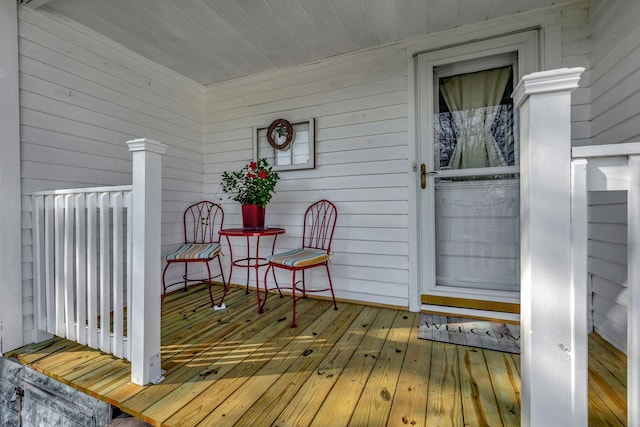 wooden terrace with a porch