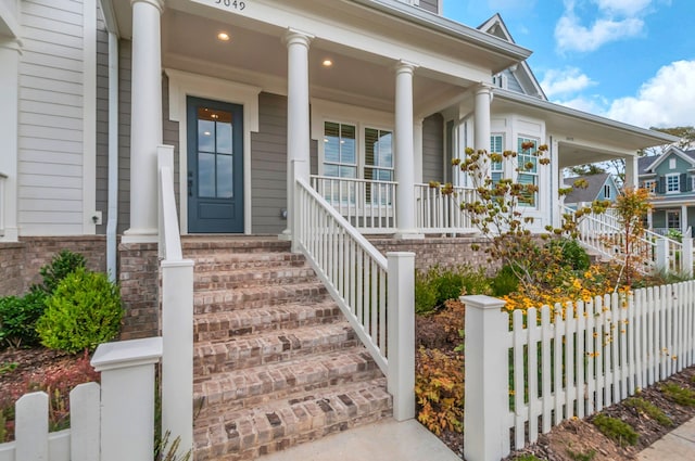 entrance to property featuring covered porch