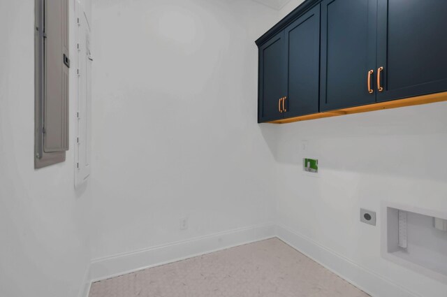 laundry room featuring cabinets and electric dryer hookup