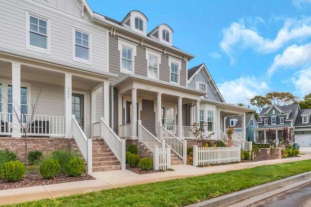 view of property featuring covered porch