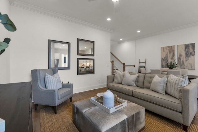 living room with ceiling fan, dark hardwood / wood-style flooring, and ornamental molding