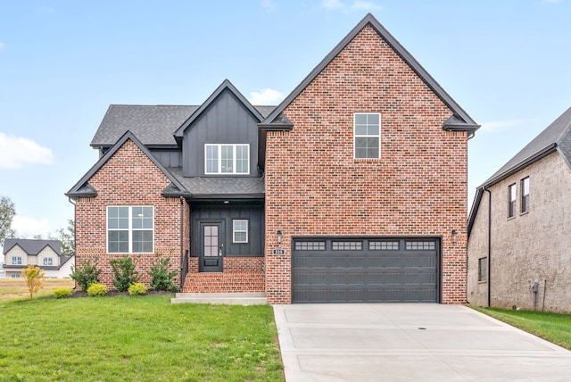 view of front property with a garage and a front yard