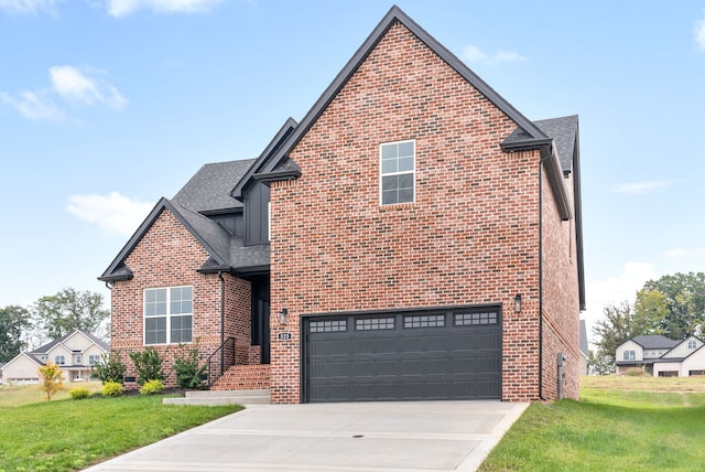 view of front property with a garage and a front lawn