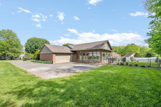 view of front of house with a front lawn and a garage