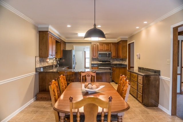 tiled dining space with sink and ornamental molding