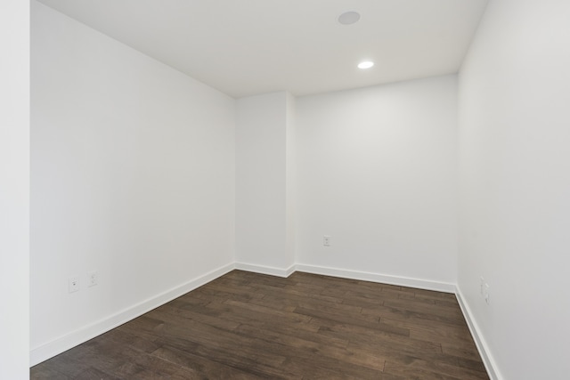 empty room featuring dark wood-type flooring