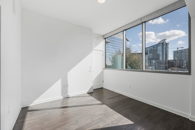 spare room featuring dark hardwood / wood-style floors