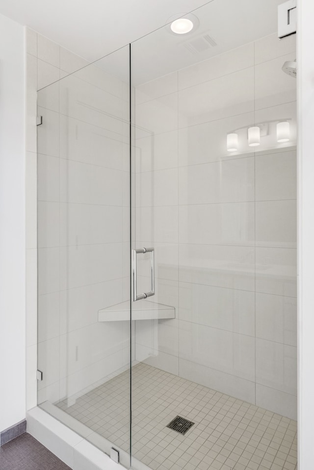 bathroom featuring an enclosed shower