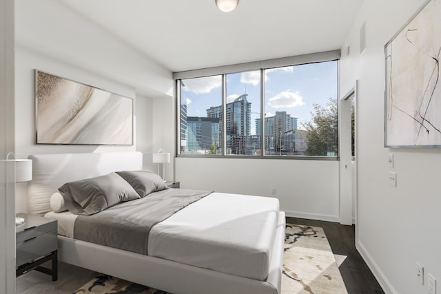 bedroom featuring dark wood-type flooring