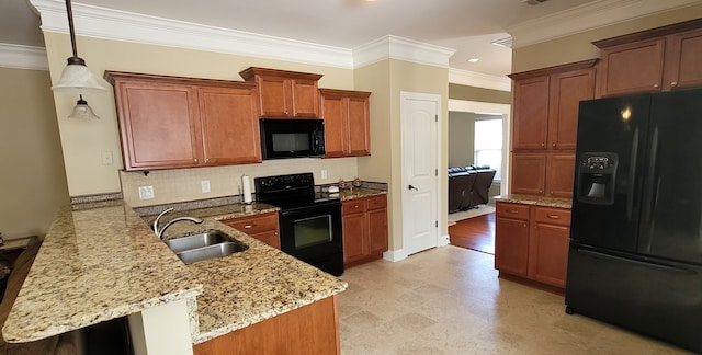 kitchen featuring sink, decorative light fixtures, crown molding, black appliances, and kitchen peninsula