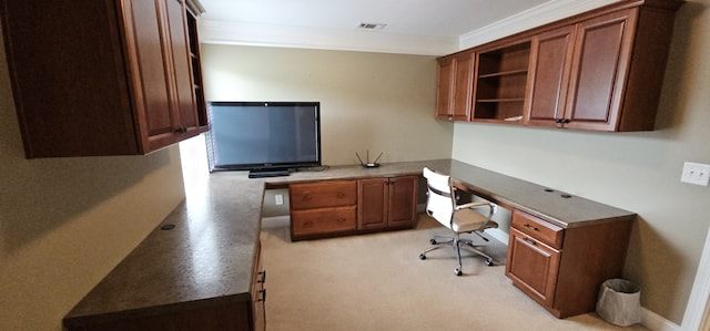 office area featuring ornamental molding and built in desk