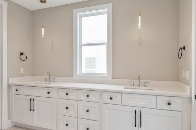 bathroom with a wealth of natural light and double vanity