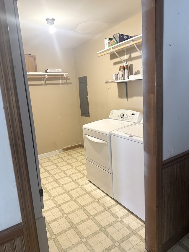 clothes washing area with electric panel and washer and clothes dryer