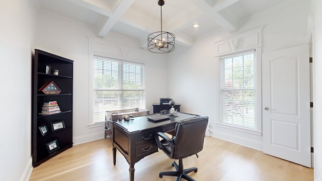 office area with a healthy amount of sunlight, light hardwood / wood-style floors, and coffered ceiling