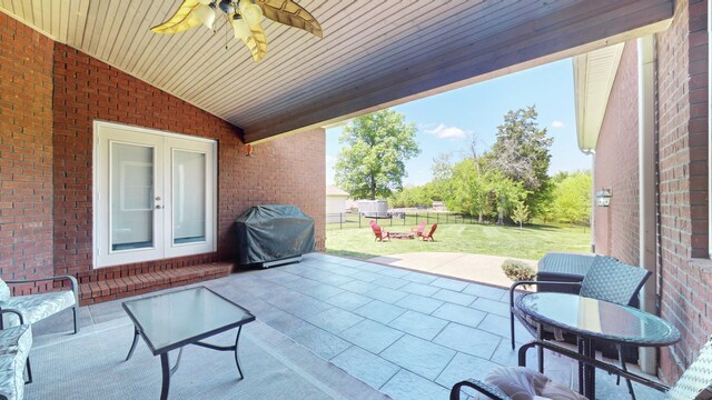 view of patio / terrace featuring a grill and ceiling fan