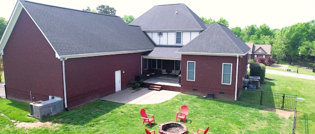 rear view of property with a lawn