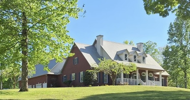 rear view of house with a yard