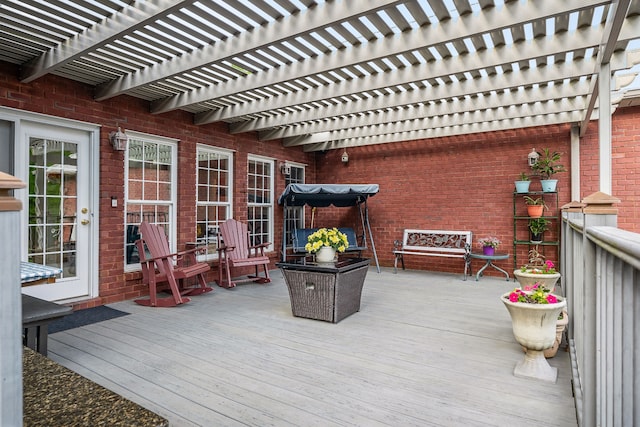 wooden deck featuring a pergola