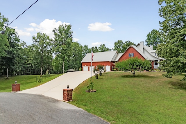 view of front of house with a garage and a front yard