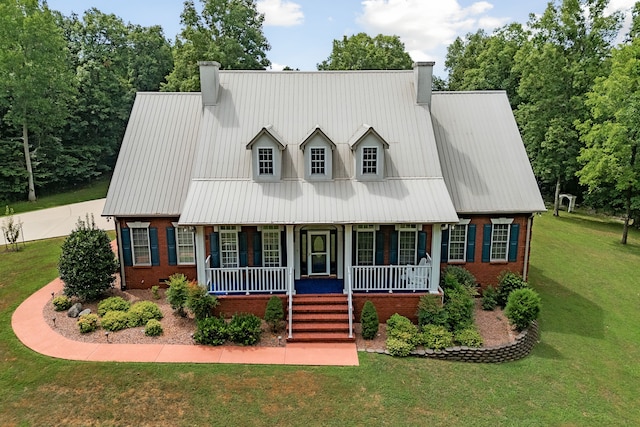 view of front of property with a porch and a front lawn