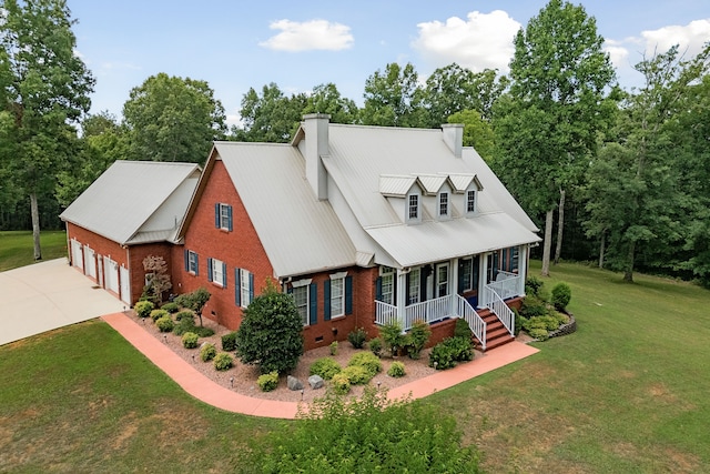 view of front facade with a front yard and covered porch