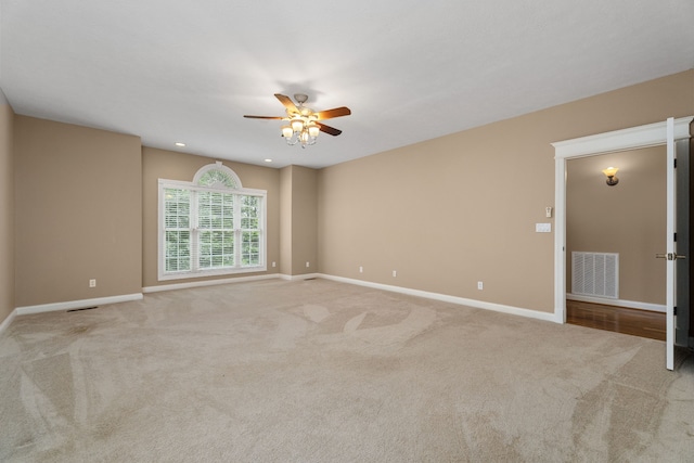 carpeted empty room with ceiling fan