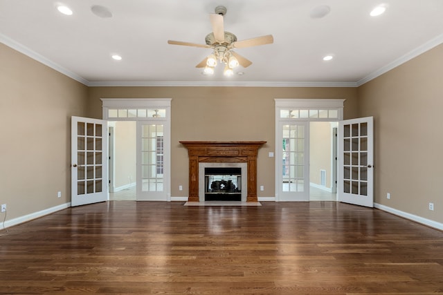 unfurnished living room with crown molding, dark wood-type flooring, french doors, and ceiling fan