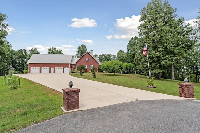 view of front facade with a garage and a front lawn