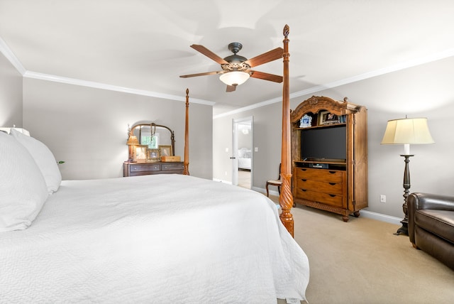 carpeted bedroom featuring ceiling fan and crown molding