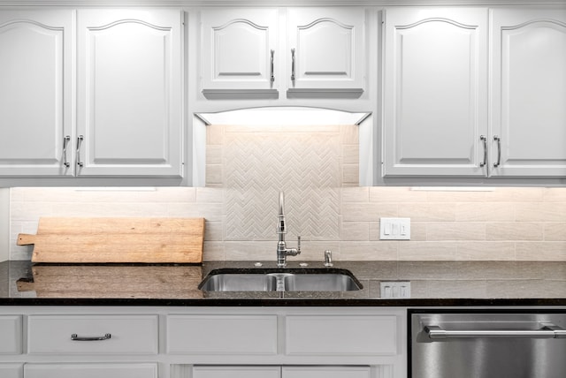 kitchen featuring dishwasher, backsplash, and white cabinetry