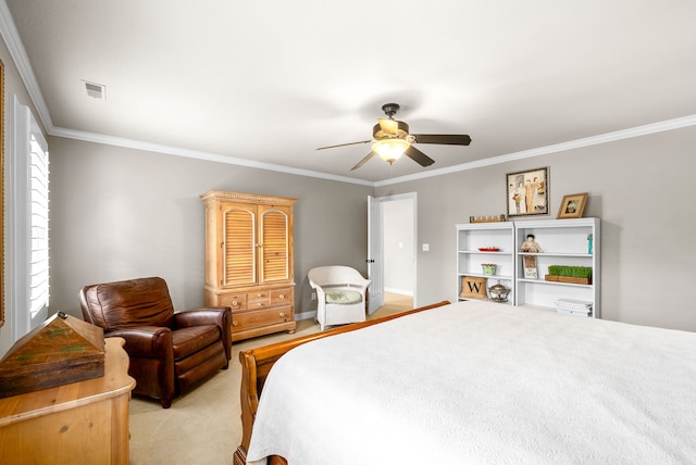 carpeted bedroom featuring ceiling fan and crown molding