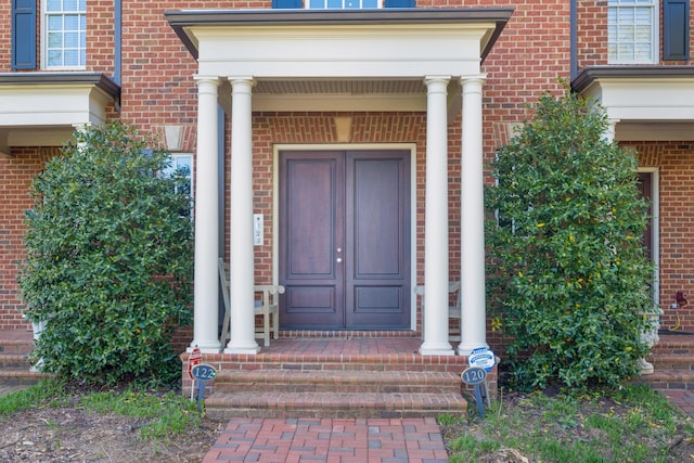 doorway to property with covered porch