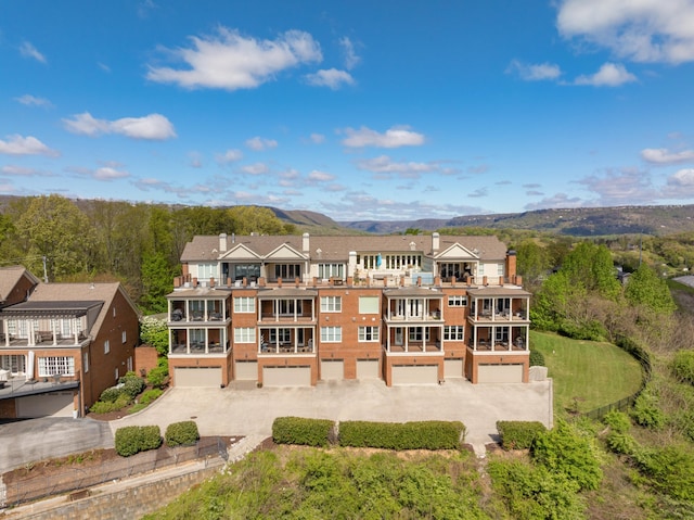 rear view of property featuring a mountain view