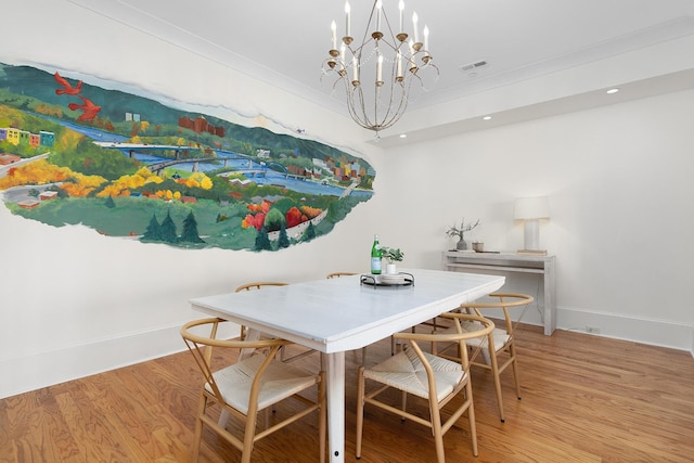 dining area featuring light hardwood / wood-style floors and a chandelier