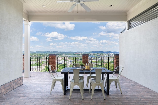 view of patio featuring ceiling fan and a mountain view