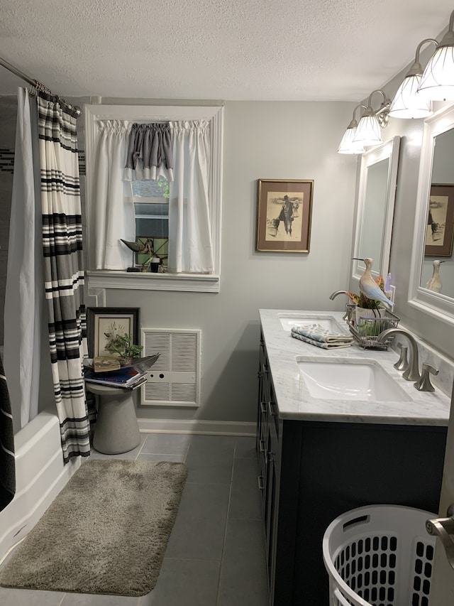 full bathroom featuring shower / bath combination with curtain, double sink vanity, toilet, tile flooring, and a textured ceiling