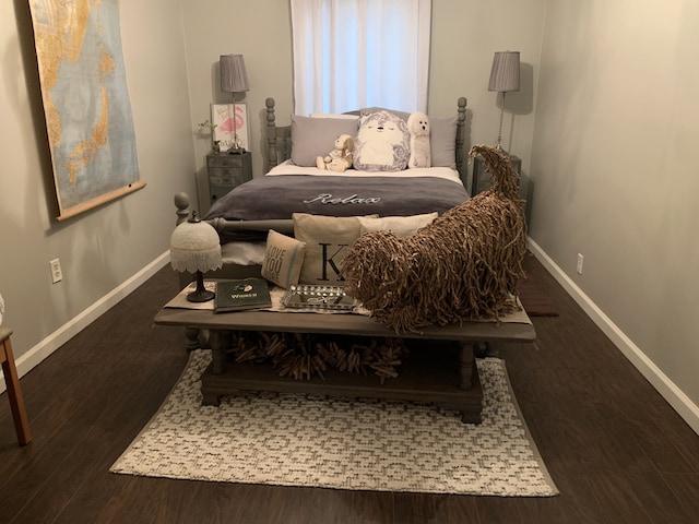 bedroom featuring dark wood-type flooring