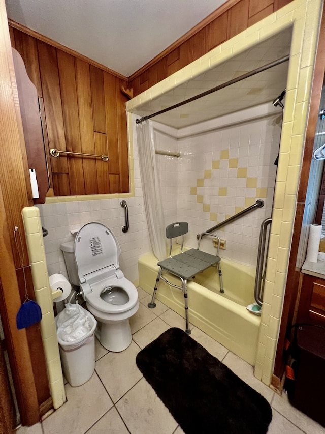 bathroom featuring tile floors, tile walls, shower / bath combo, and toilet