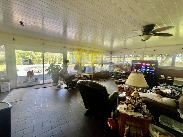 sunroom with wooden ceiling and ceiling fan