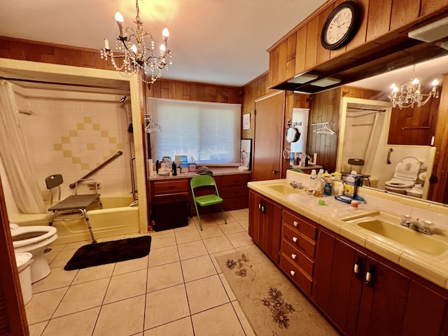 full bathroom featuring dual bowl vanity, toilet, tiled shower / bath combo, a notable chandelier, and tile floors